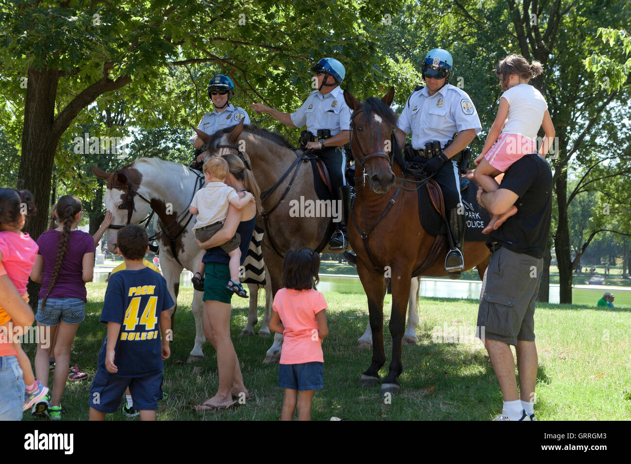 US Park Police on horseback interacting with public - USA Stock Photo