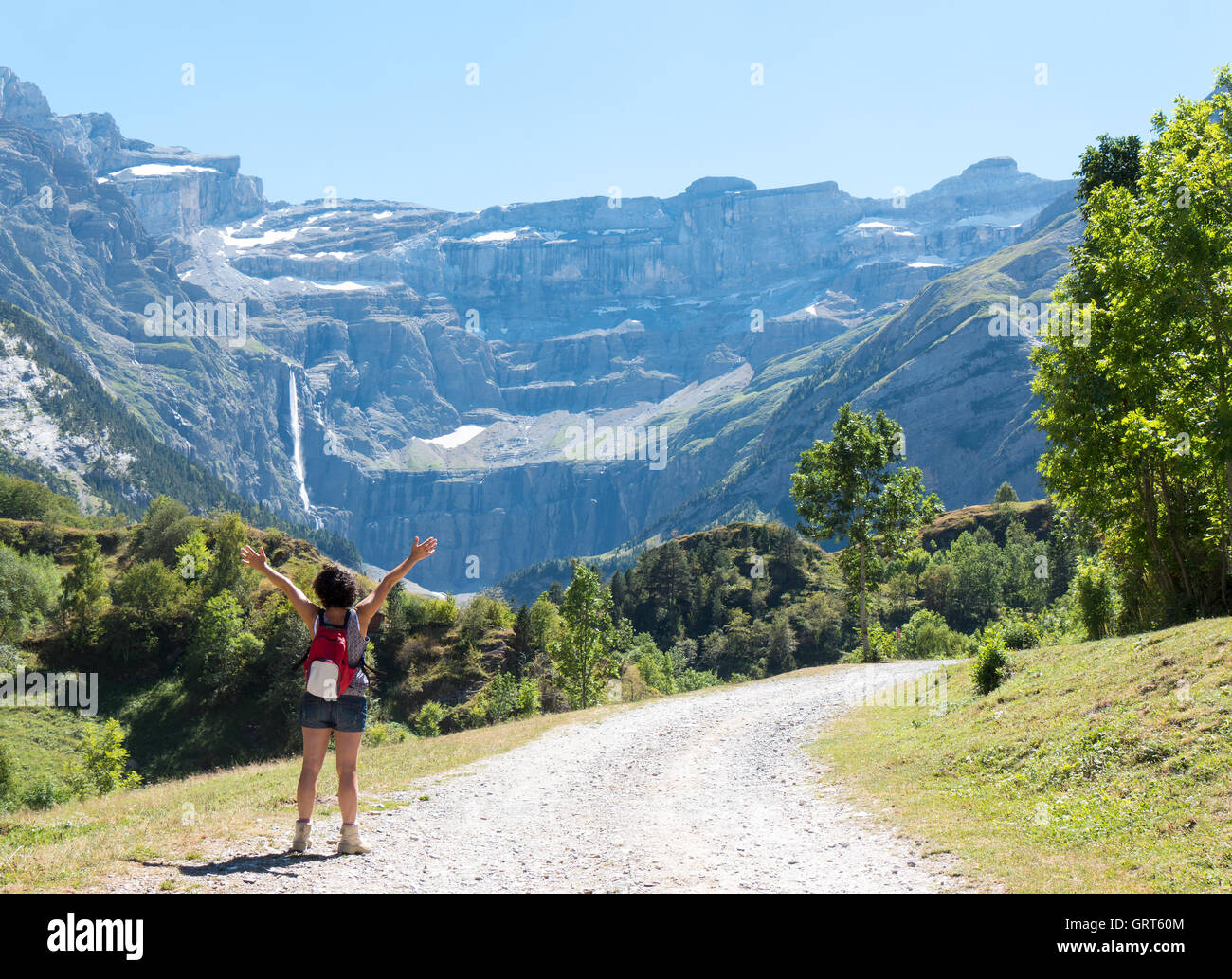 A woman hiker and cirque de Gavarnie in the French pyrenees Stock Photo ...