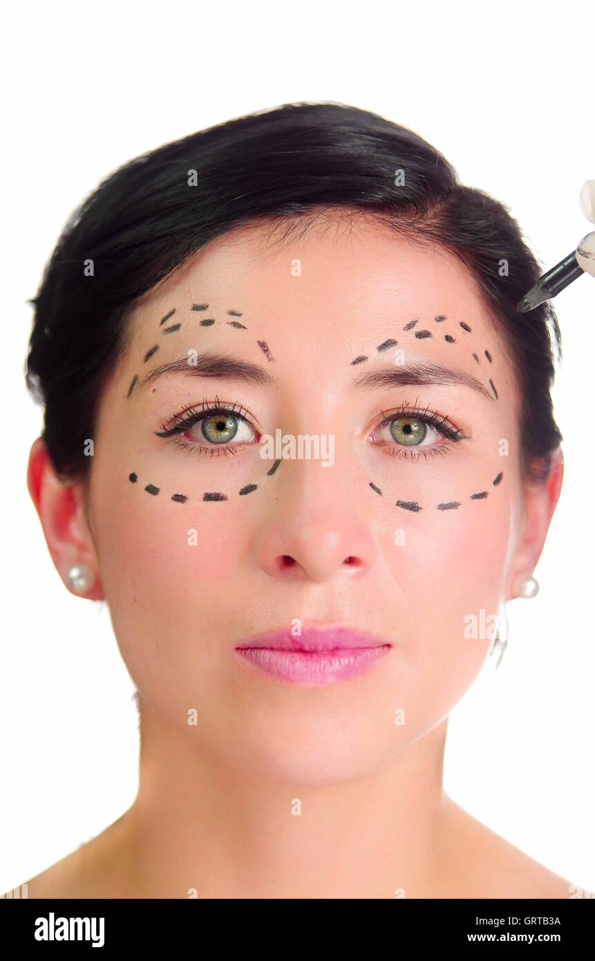 Headshot caucasian woman with dotted lines drawn around eyes looking into camera, preparing cosmetic surgery Stock Photo