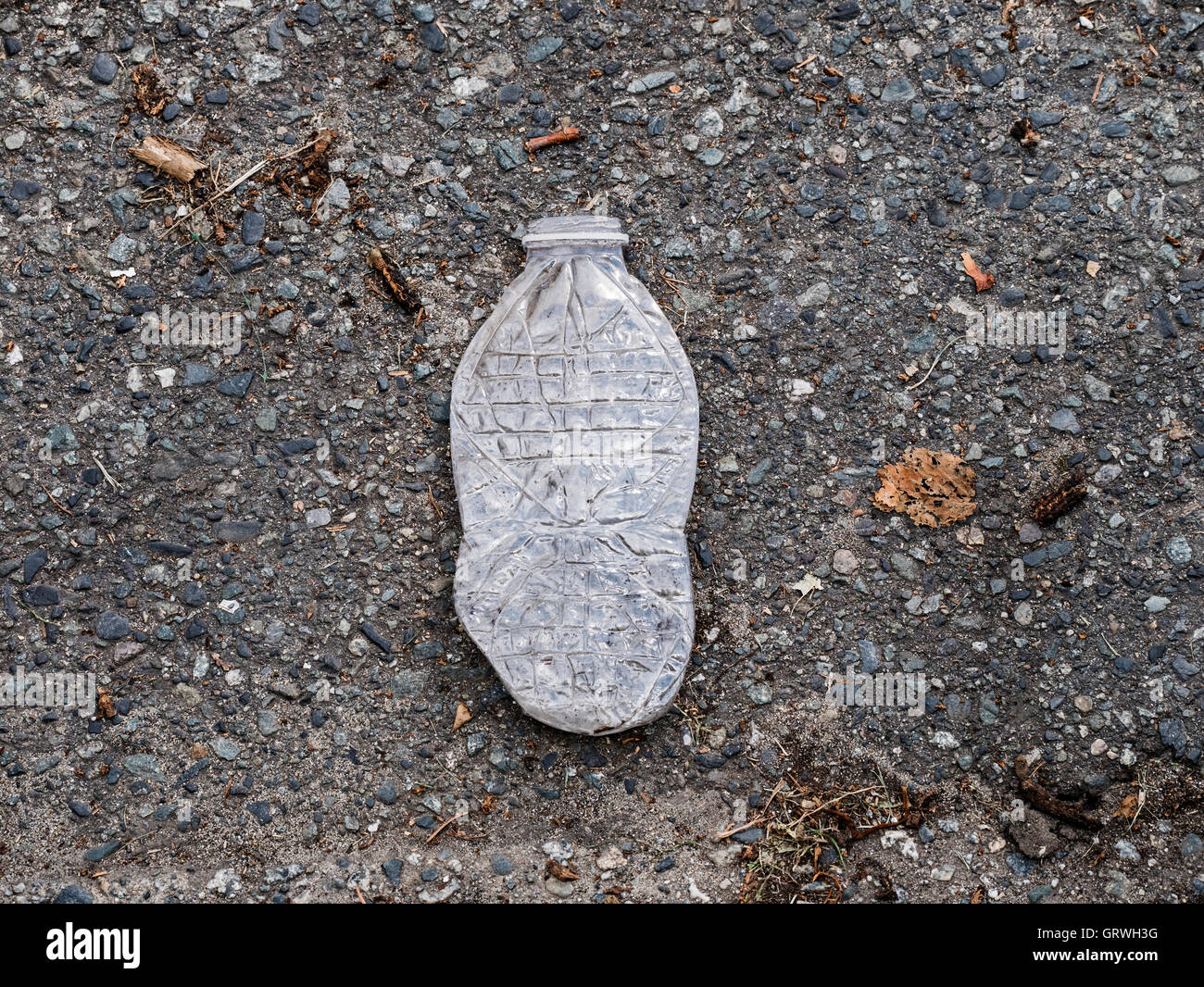 Litter crushed plastic bottle city street Stock Photo