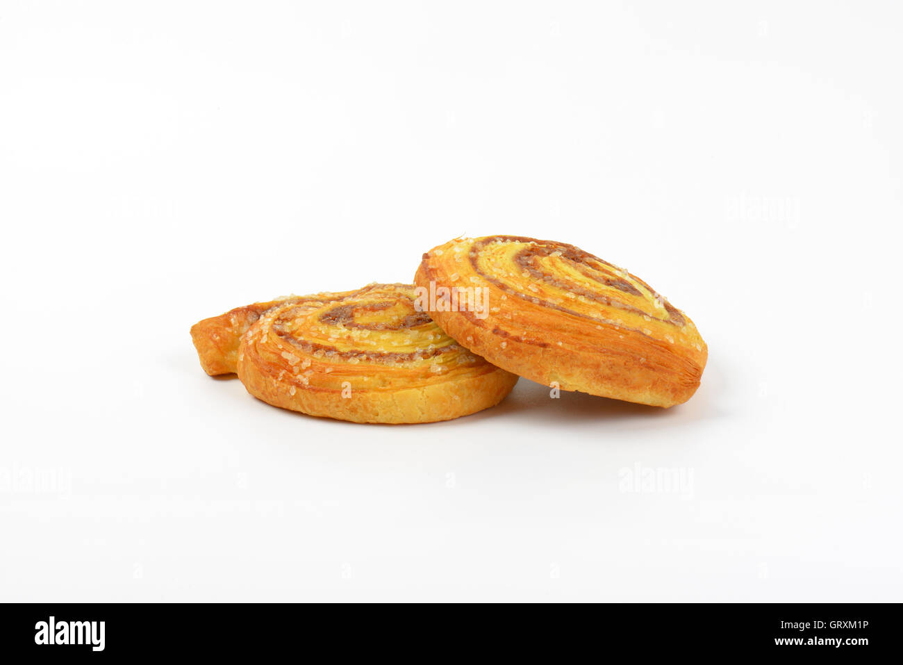 two sweet cinnamon rolls on white background Stock Photo - Alamy