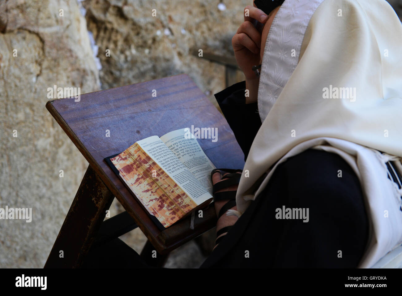 Jewish men praying by the Wailing wall in the old city of Jerusalem. Stock Photo