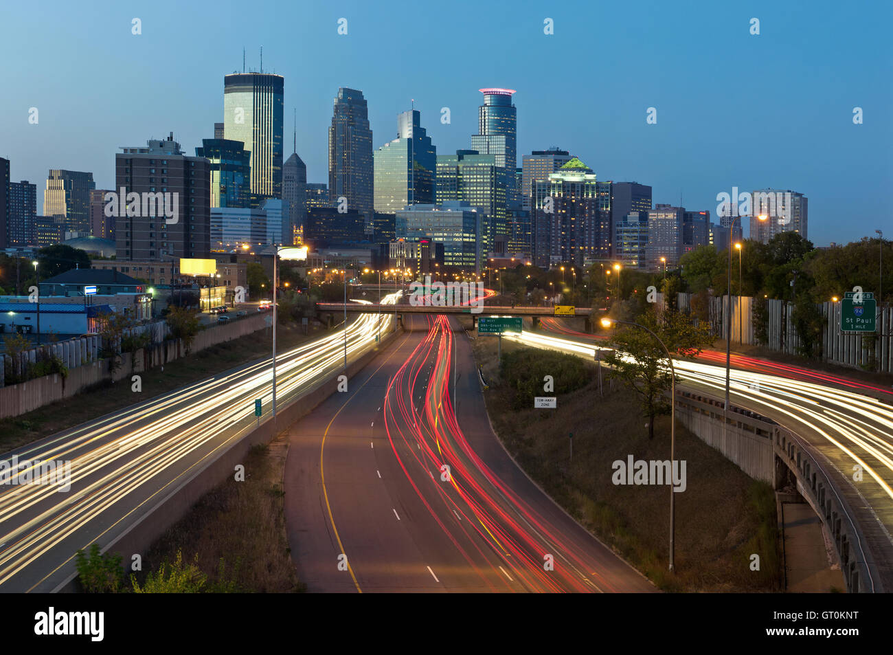 Minneapolis. Image of Minneapolis skyline and highway with traffic lines leading to the city. Stock Photo