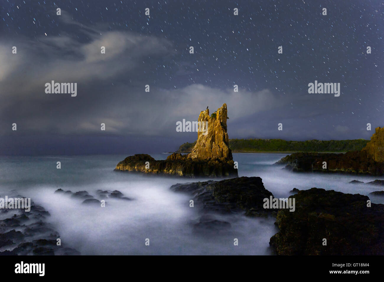 Night Sky and motion blur at Cathedral Rock, Kiama, New South Wales, NSW, Australia Stock Photo