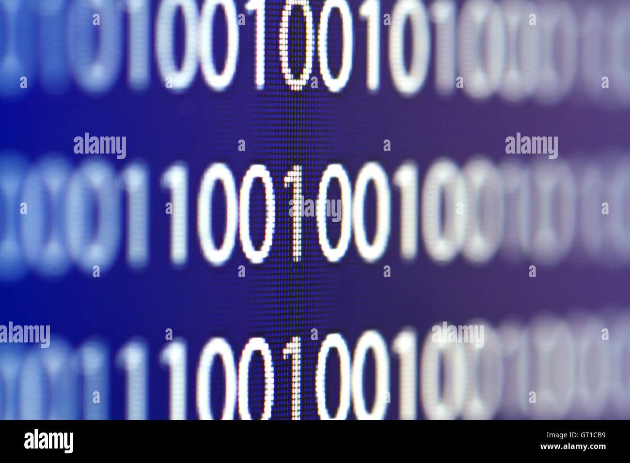 Binary code on a computer monitor blurred background Stock Photo - Alamy