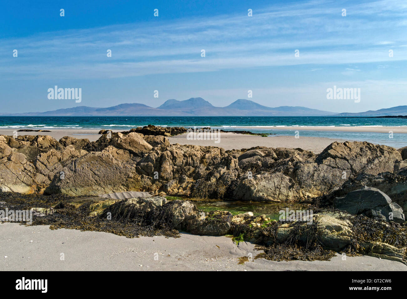 The Isle of Jura seen from sandy beach at The Strand on the Hebridean Island of Colonsay, Scotland, UK. Stock Photo