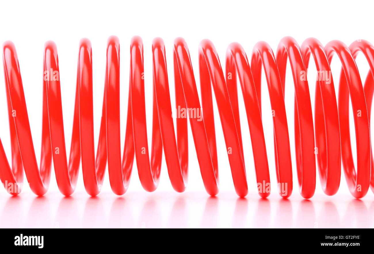 Plastic spring isolated on a white background Stock Photo Alamy