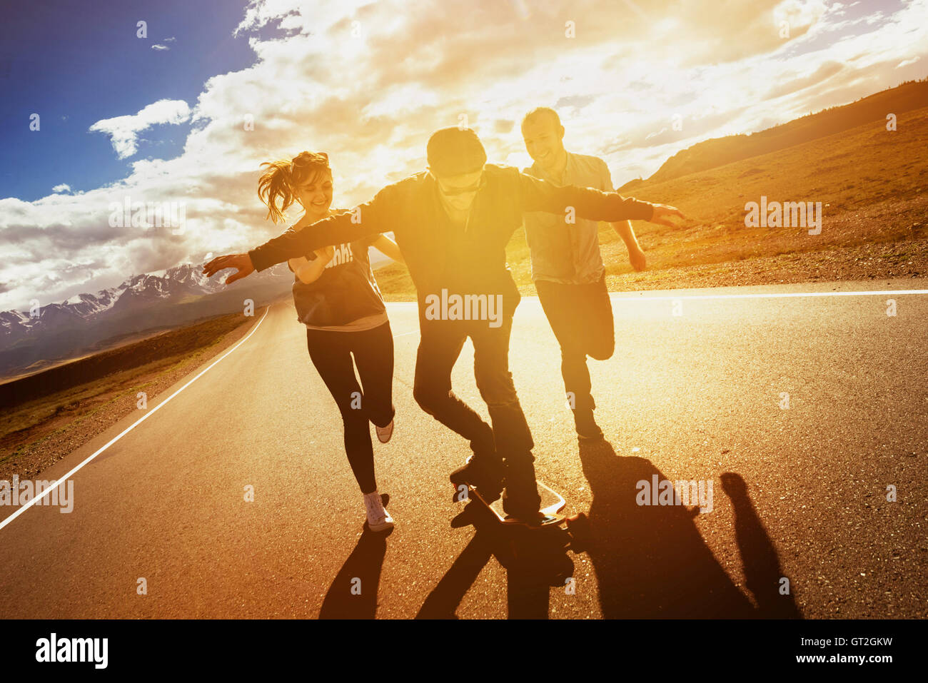 Group friends longboarding road travel concept Stock Photo