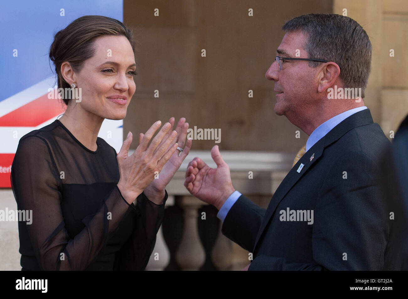 UN Special Envoy, Angelina Jolie speaks to US Defence Secretary Ash Carter at the UN Peacekeeping Defence Ministerial in London. Stock Photo
