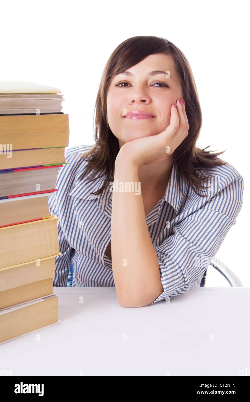 Smiling student girl with pile of books Stock Photo - Alamy
