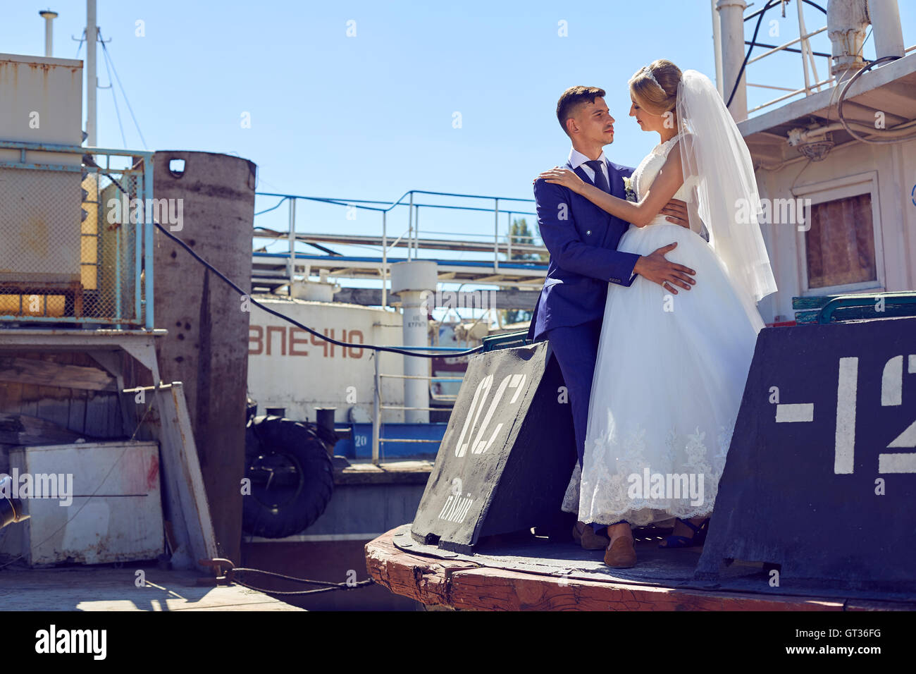 Beautiful young newlyweds on the wedding  the boat Stock Photo