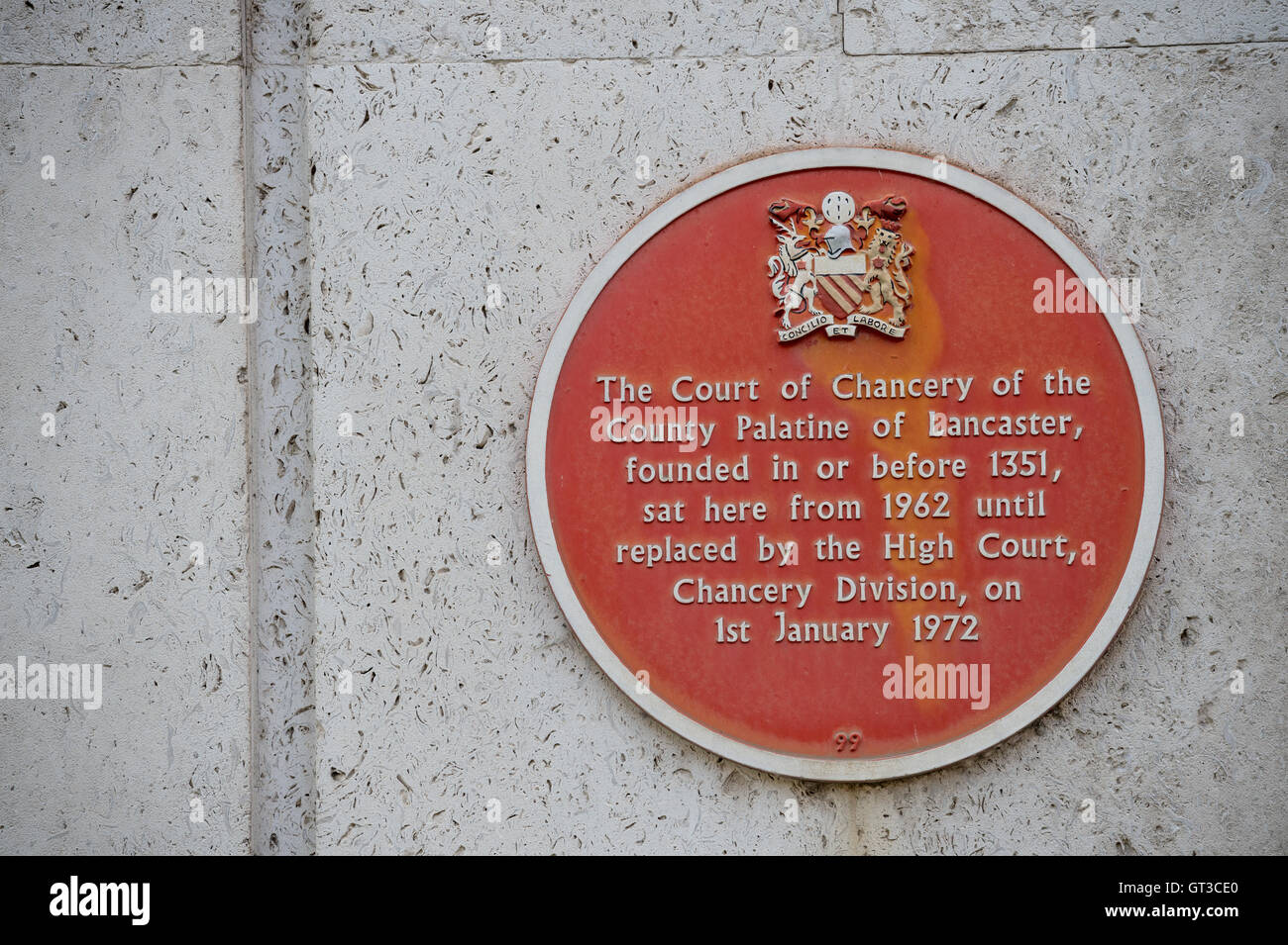 A red plaque on the side of Manchester Crown Court-The Court of Chancery of the County Palatine of Lancaster. Stock Photo