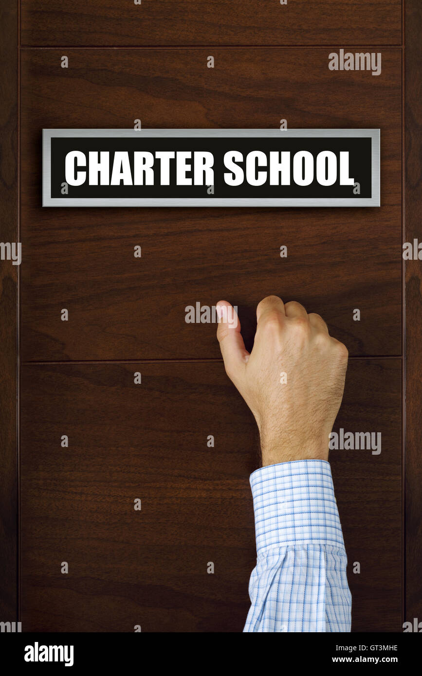 Charter school concept, male hand knocking on the door Stock Photo