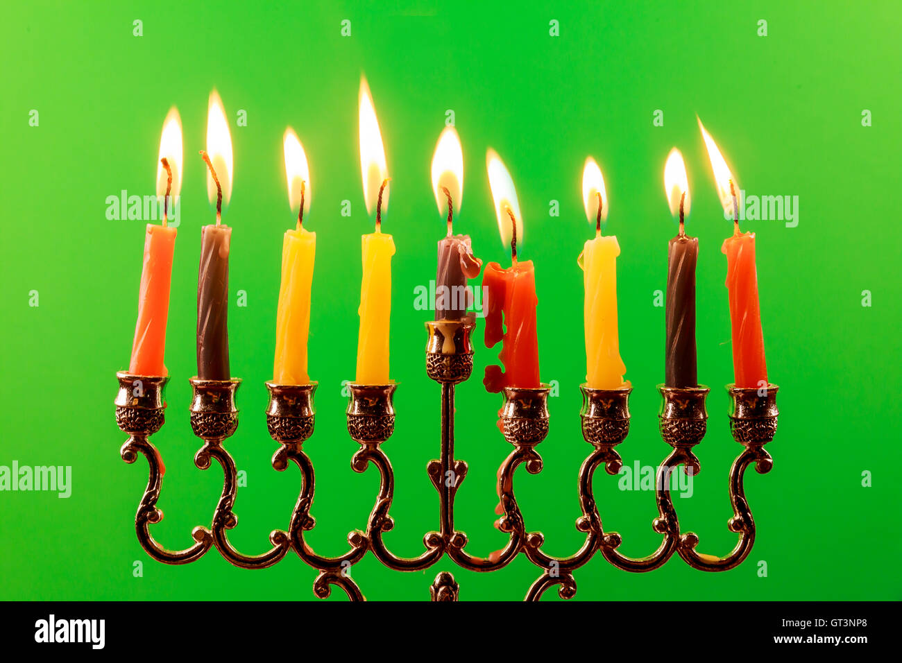 Menora of Hanuka on greenscreen Hanukkah menorah with candles Stock