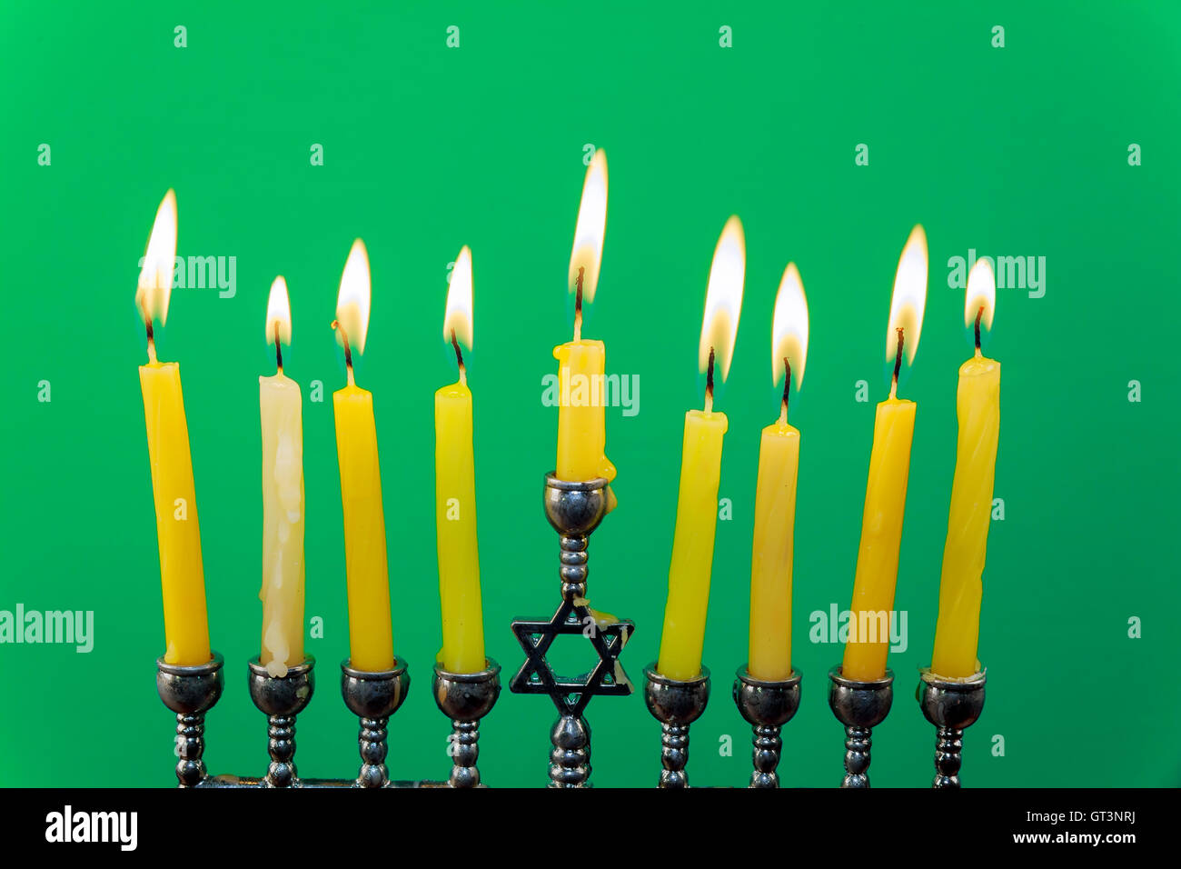 Menora of Hanuka on greenscreen Hanukkah menorah with candles Stock