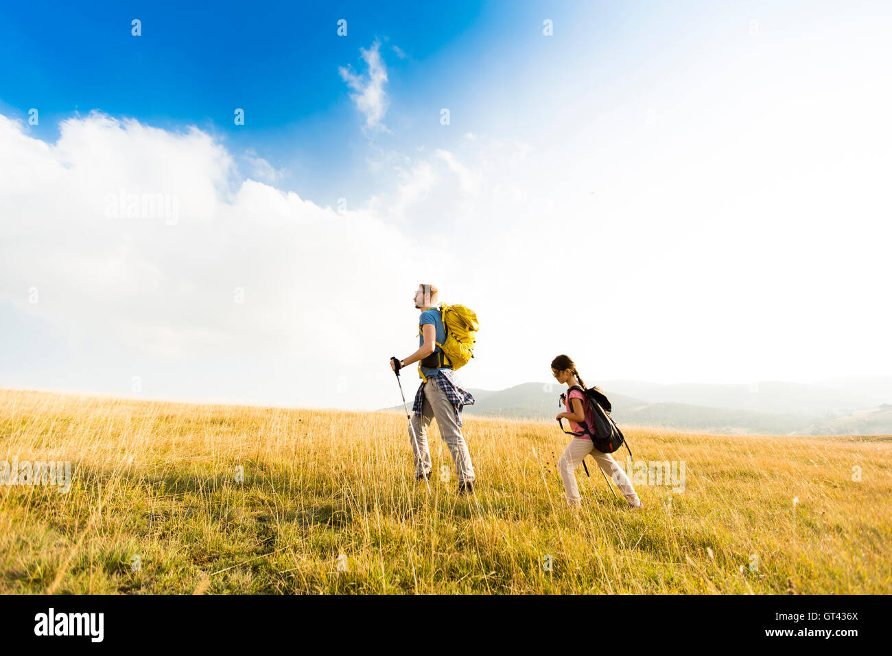 Young father and daughter enjoy hiking on a sunny day Stock Photo