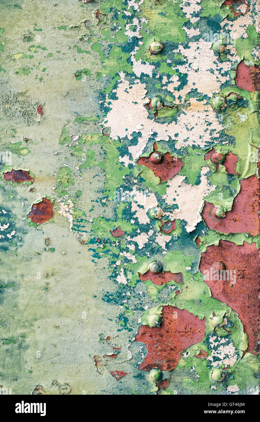 Peeling paint rust and rivets texture. Old metal garage door Stock