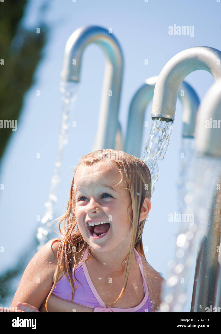 Child in a water fountain Stock Photo Alamy