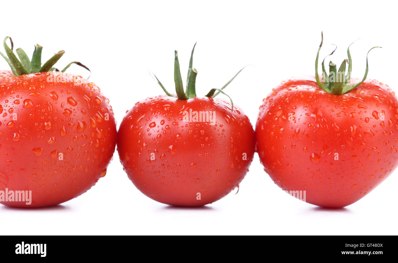 Three red ripe tomatoes isolated Stock Photo - Alamy