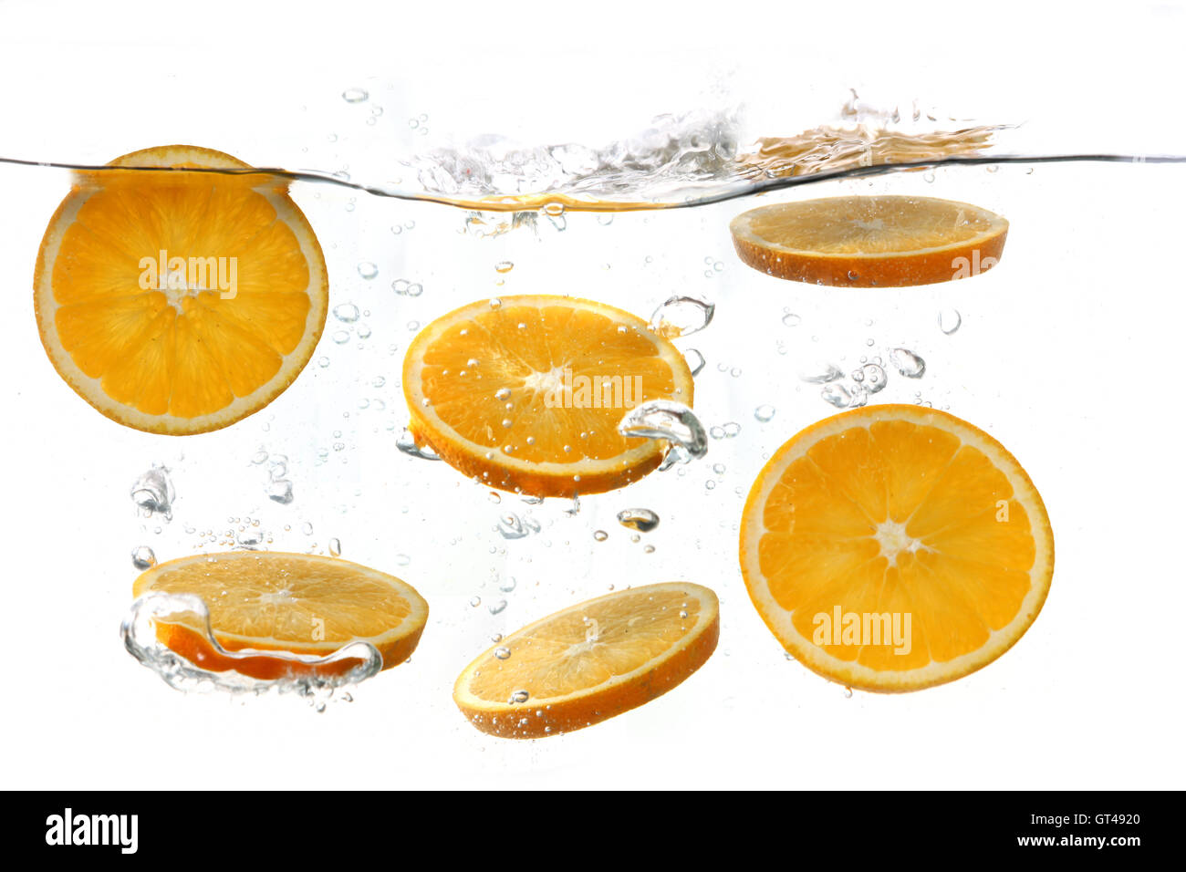 Oranges Falling Into Splashing Clear Water Stock Photo Alamy