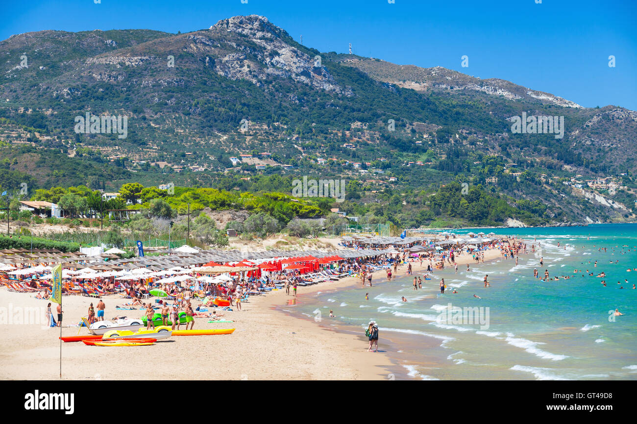 Zakynthos, Greece - August 15, 2016: Tourists resting on Banana Beach. One of the most popular resort of Greek island Zakynthos. Stock Photo