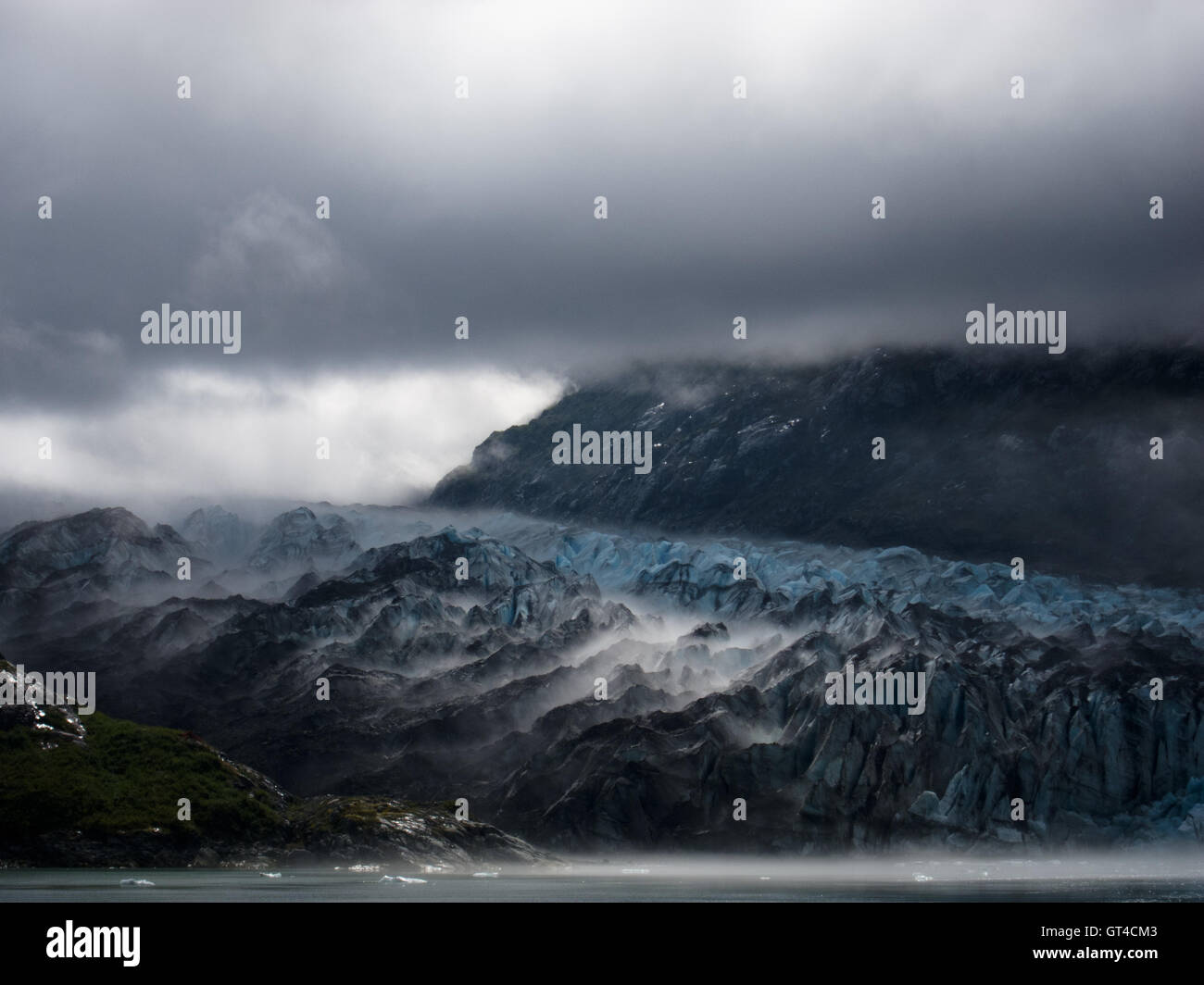 Moody light over Lamplugh Glacier in Glacier Bay National Park, Alaska Stock Photo