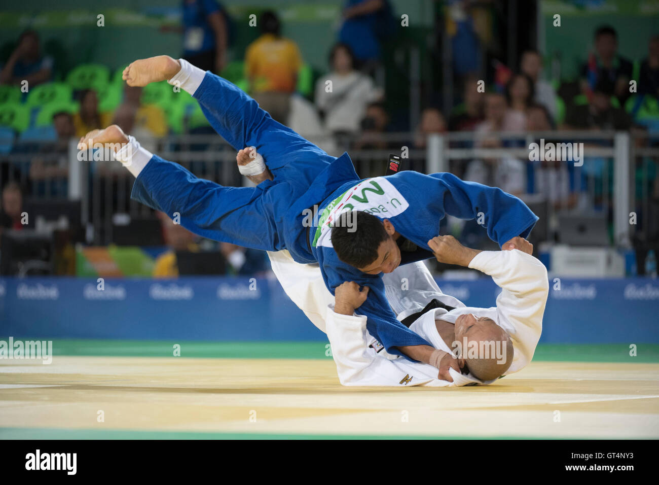 Rio de Janeiro, Brazil. 8th September, 2016. Uugankhuu Bolormaa of Mongolia (blue) is thrown by Hirose Makoto of Japan during the 60kg semi final in men's judo on the first day of competition at the 2016 Paralympic Games.  Makoto won the match. Credit:  Bob Daemmrich/Alamy Live News Stock Photo