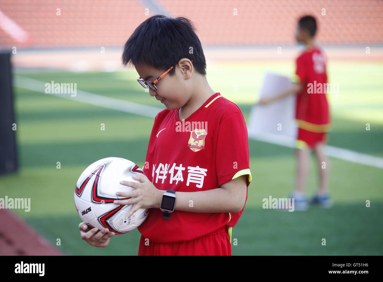 Heihe, Heihe, China. 9th Sep, 2016. Heihe, CHINA-?August 27 2016:?(EDITORIAL?USE?ONLY.?CHINA?OUT) A ball boy at the Sino-Russian football match. A Sino-Russian football match is held in Heihe, northeast ChinaÂ¡Â¯s Heilongjang Province. Dozens of Chinese ball boys take the responsibility of picking up football during the match. © SIPA Asia/ZUMA Wire/Alamy Live News Stock Photo