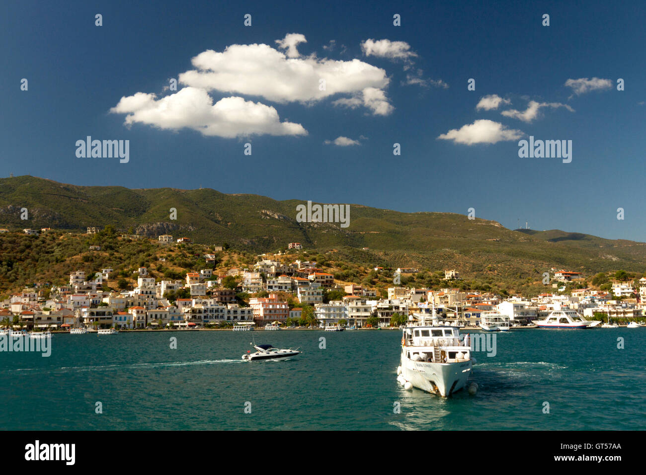The town of Galatas, as seen from Poros island, Greece. The strait between Galatas and the island is about 2 minutes long to cross on boat. Stock Photo