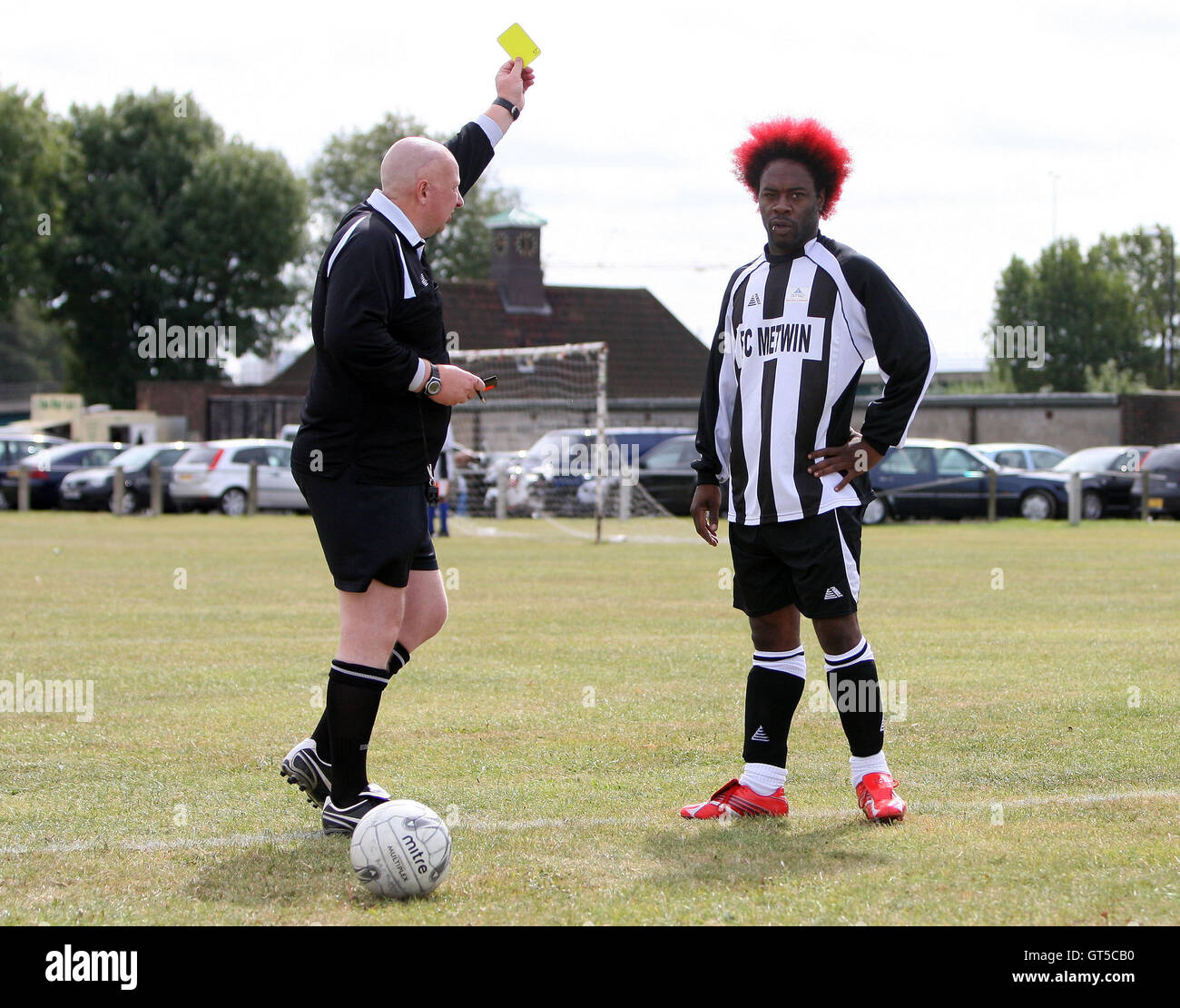A yellow card is shown - FC Metwin (black/white) vs Adam & Eve ...