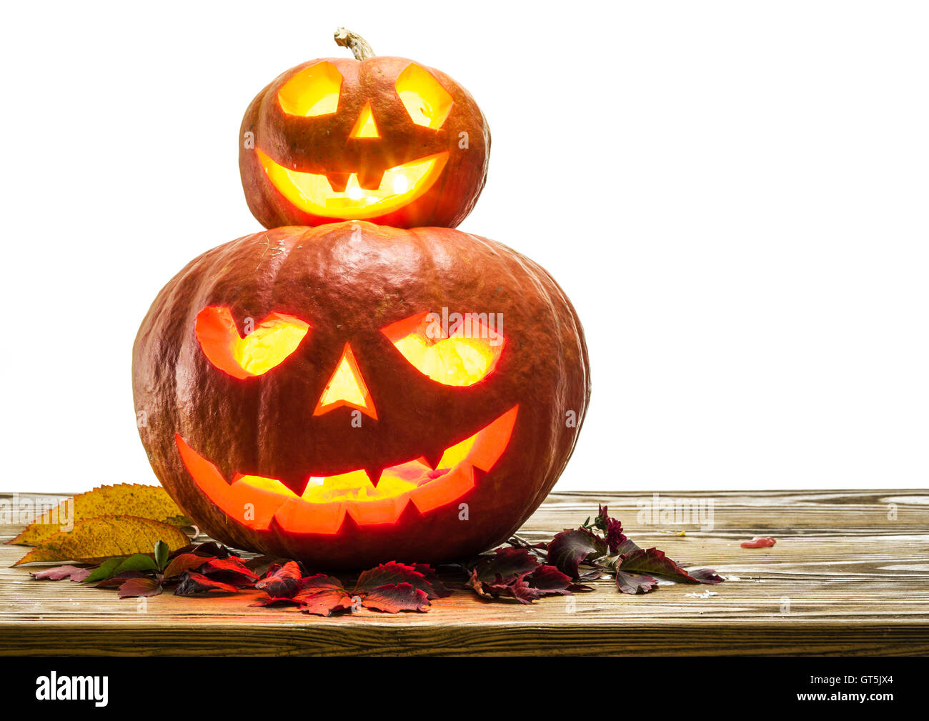 Grinning pumpkin lantern or jack-o'-lantern is one of the symbols of Halloween. Halloween attribute. Stock Photo