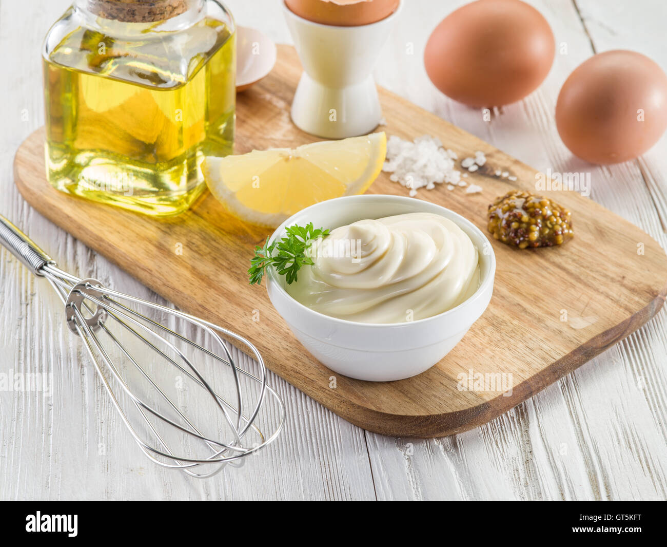 Natural mayonnaise ingredients and the sauce itself. Stock Photo