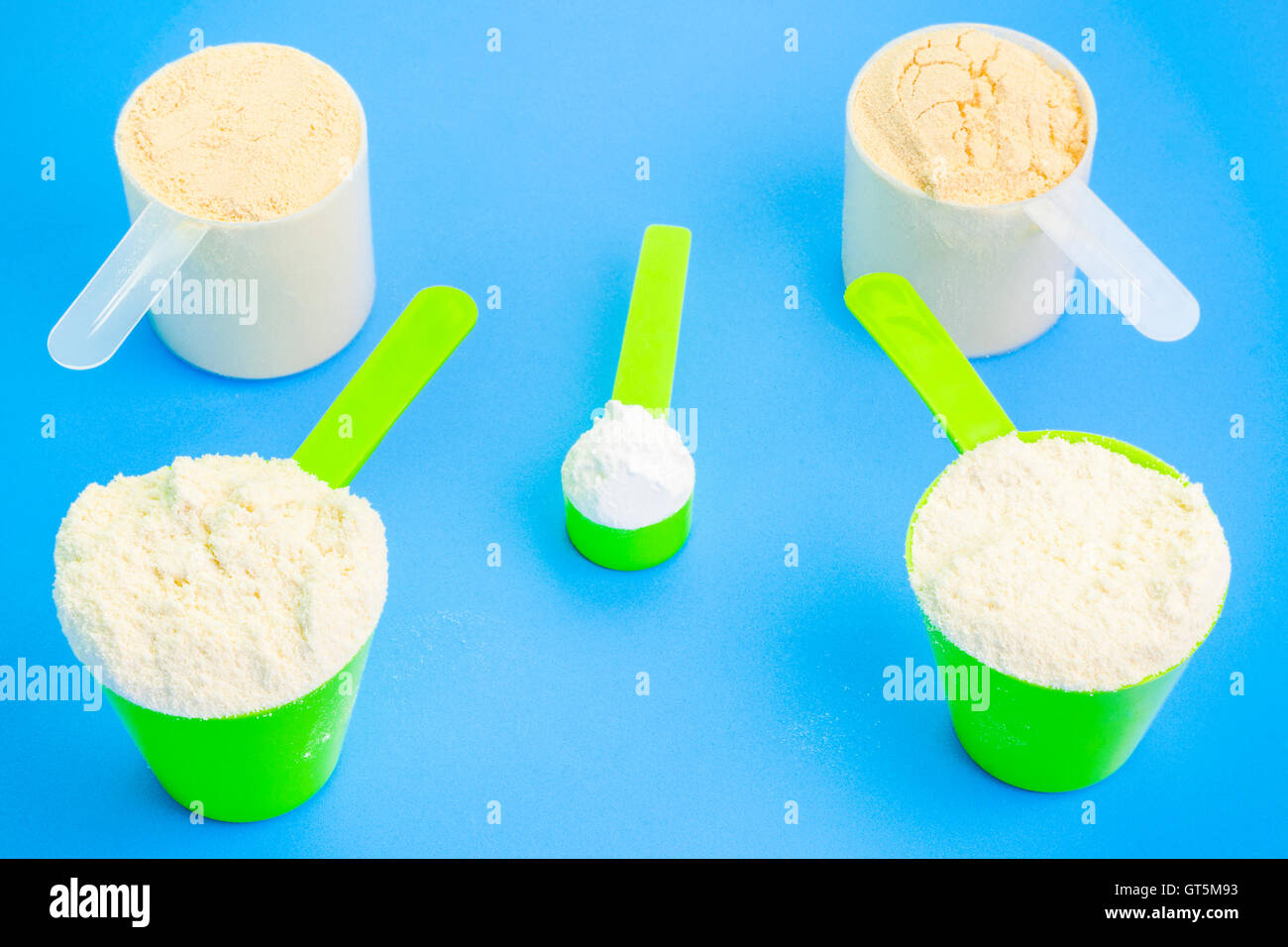 Scoops with pure whey protein ,creatine and pea protein Stock Photo Alamy