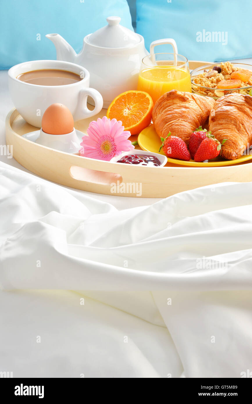 Breakfast tray in bed in hotel room Stock Photo - Alamy