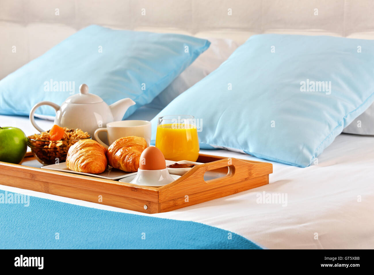 Breakfast on tray in bed in hotel room Stock Photo - Alamy