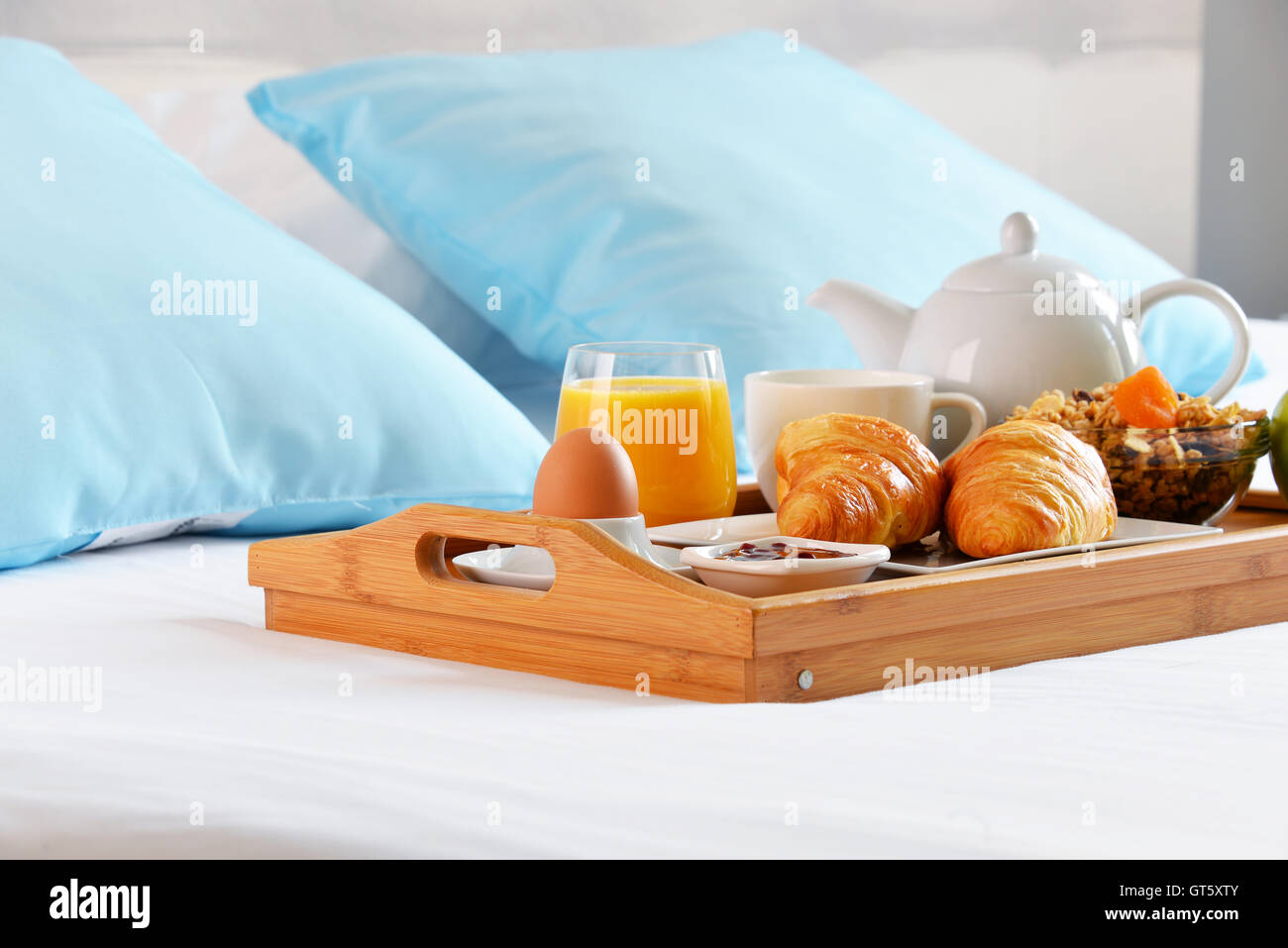 Breakfast on tray in bed in hotel room Stock Photo - Alamy