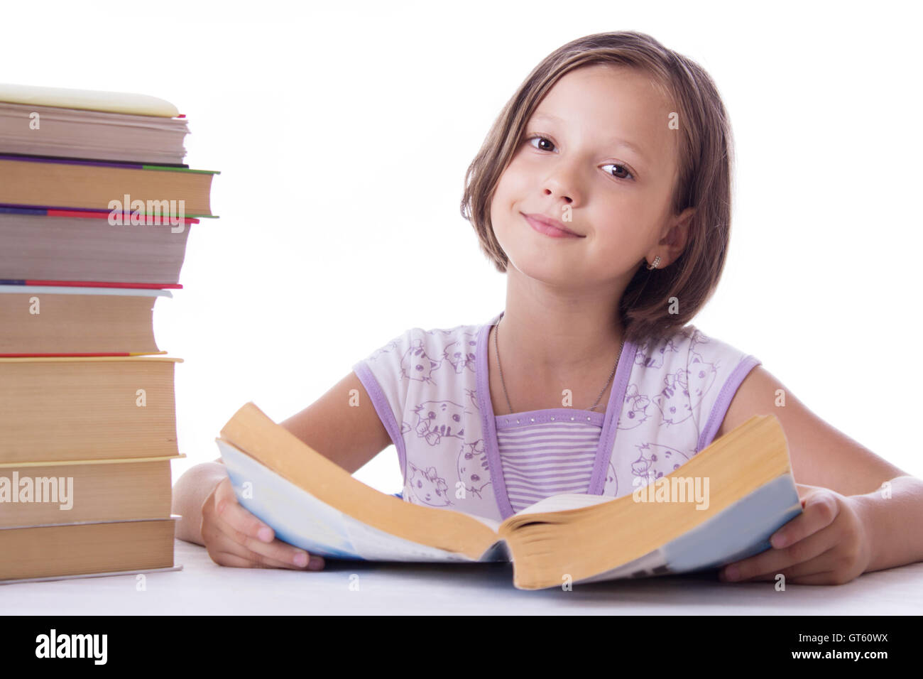 Pretty girl with pile of books Stock Photo - Alamy
