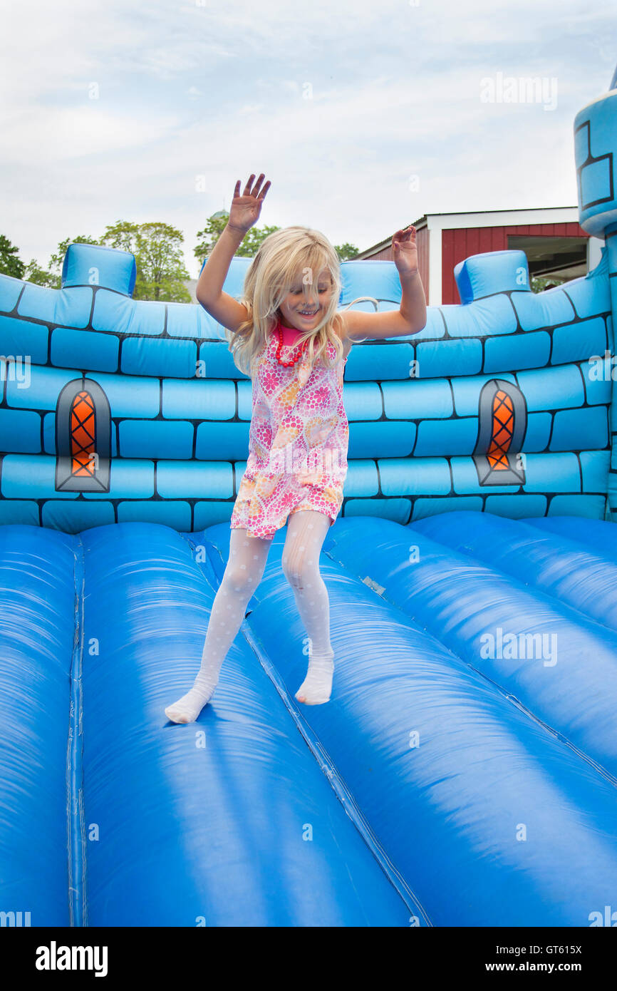 Child in bouncing castle Stock Photo Alamy