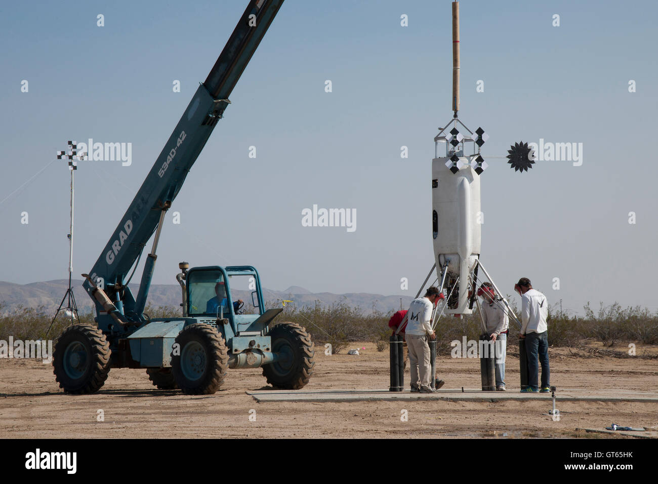 Researchers check the Masten Space Systems Vertical Takeoff Vertical