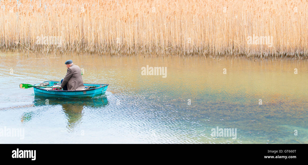 old man in the small boat Stock Photo - Alamy