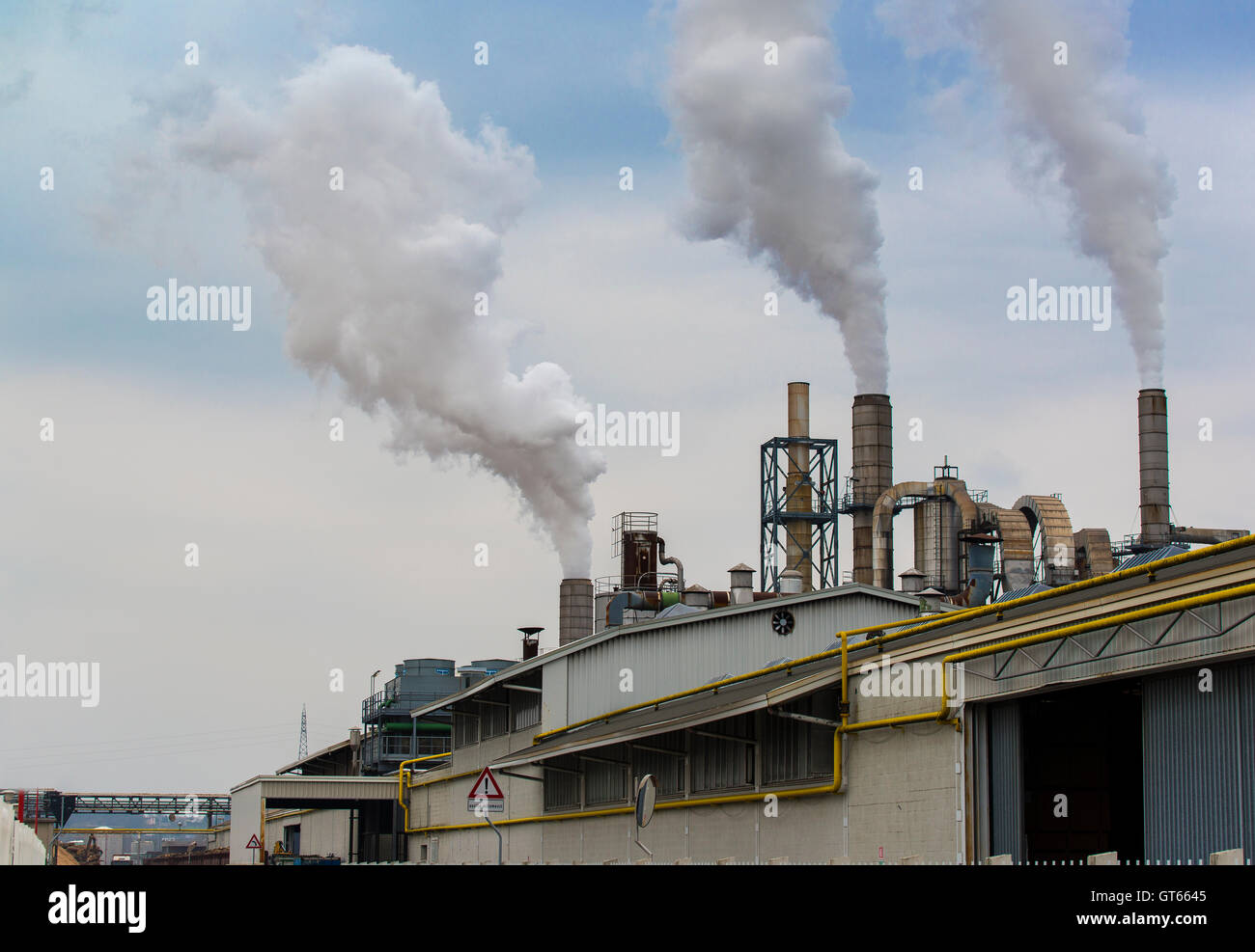 environment pollution smoke factory chimney industry sky air steam smog energy power industrial plant global warming chemical  Stock Photo