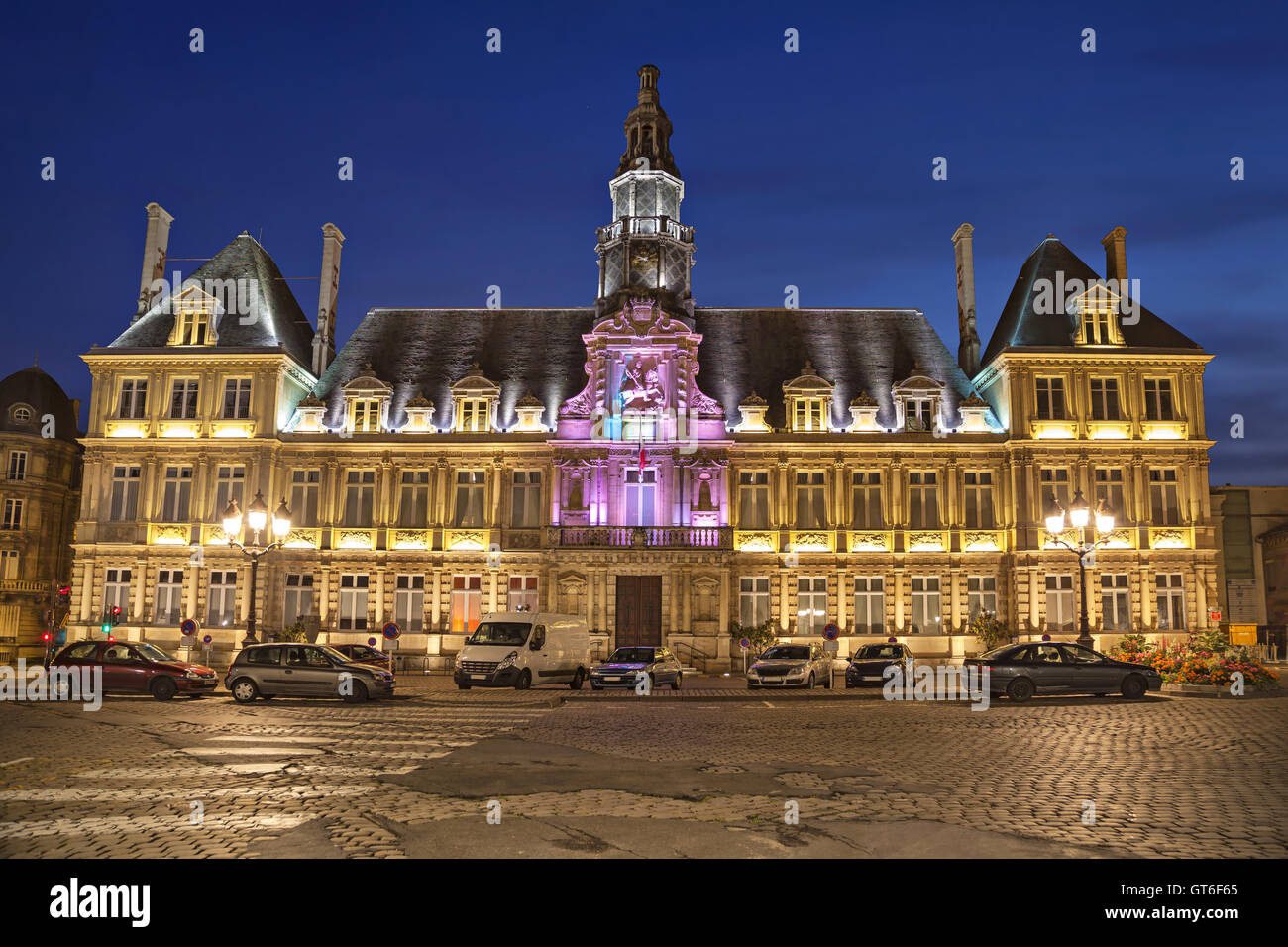 Illuminated city hall of Reims in the evening, Champagne-Ardenne, France Stock Photo