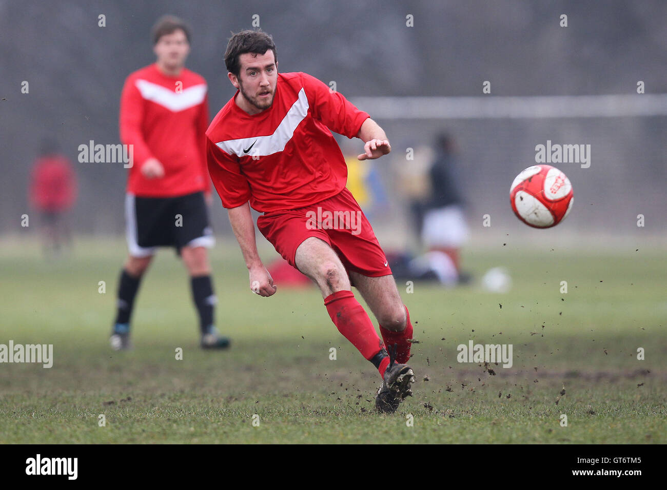 Shakespeare (red) vs MDM United - Hackney & Leyton Sunday League Football at South Marsh, Hackney Marshes, London - 15/02/15 Stock Photo