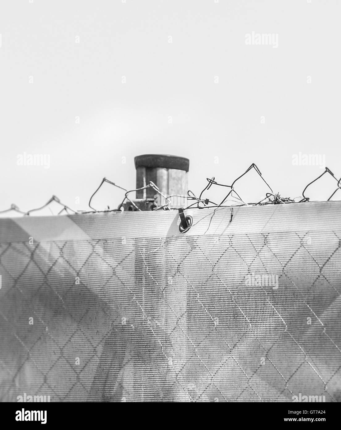 Steel fence razor wire Black and White Stock Photos & Images - Alamy