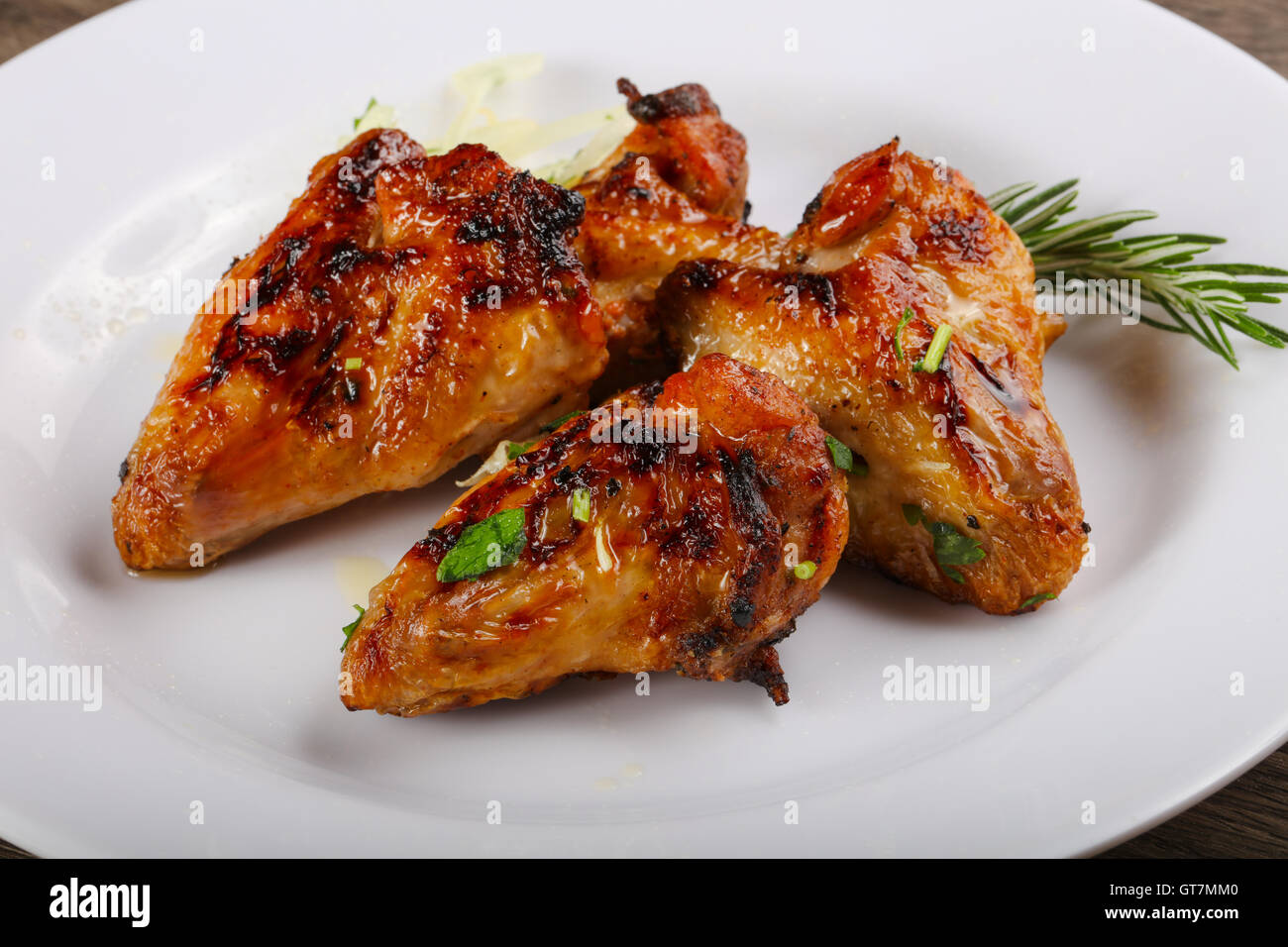 Grilled chicken wings bbq with parsley and onion Stock Photo Alamy
