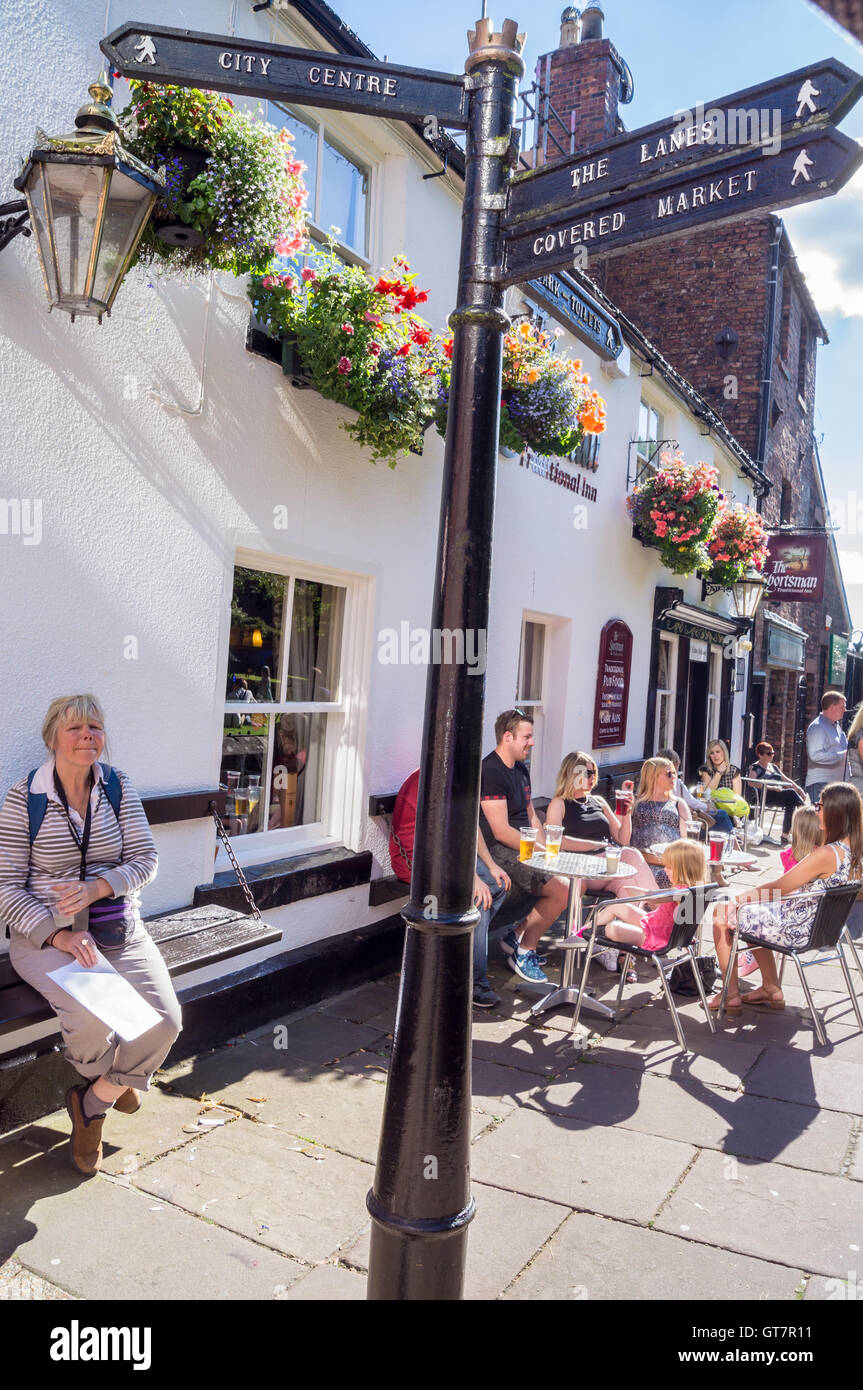 A fingerpost with directions to the town centre outside the Sportsman