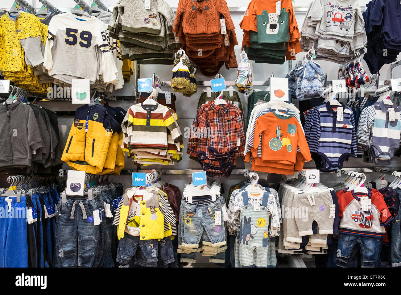 Childrens clothing on display in a Morrisons supermarket. Stock Photo