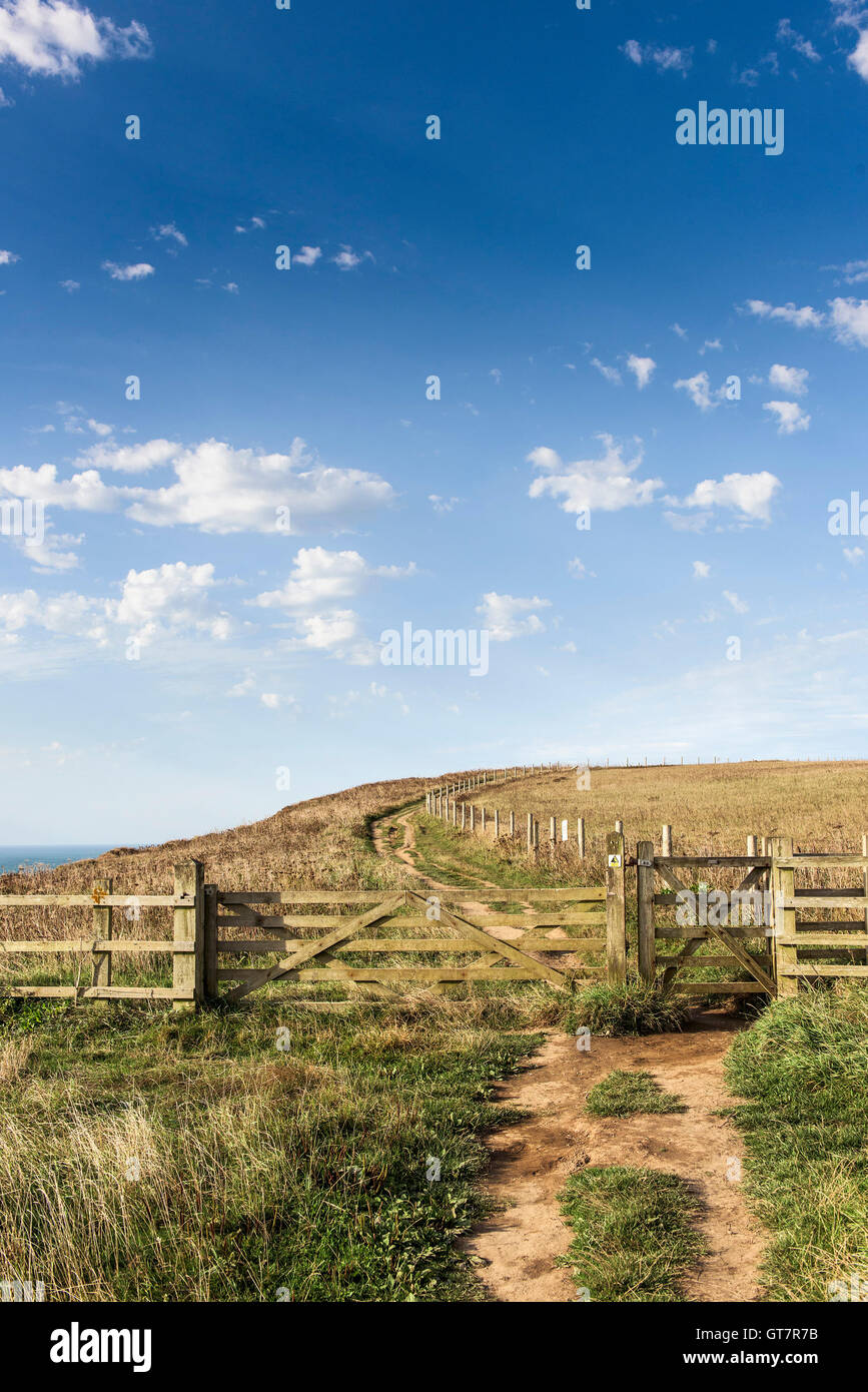 A gate on the South West Coastal Path running from Newquay to Watergate Bay in Cornwall. Stock Photo