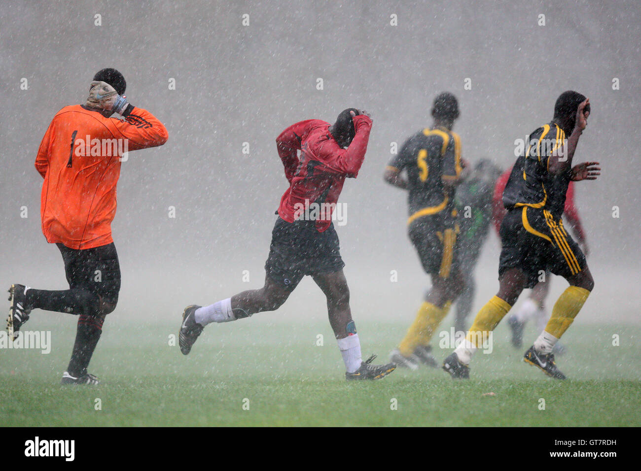 Hail Storm Ranger Woodgrange Rangers FC players run for cover during a hailstorm at ...