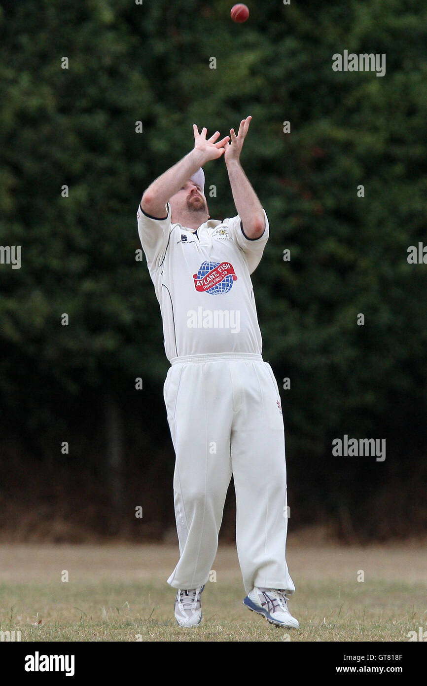 K Chapman of Ardleigh Green takes a catch to dismiss N Thorpe - Ardleigh Green CC 4th XI vs Old Parkonians CC 3rd XI - Essex Cricket League - 07/08/10 Stock Photo